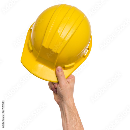 Male Hand with yellow safety helmet. Human Hand holding hard hat, Isolated on White Background.