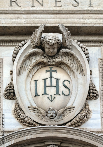 Christogram IHS, facade of the Church of the Gesu, mother church of the Society of Jesus, Rome, Italy 