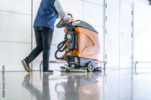 cleaning floor with machine