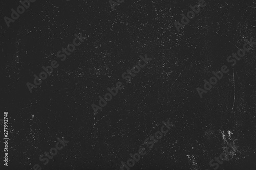 White dust and scratches over black surface. Grainy texture background. Empty space.