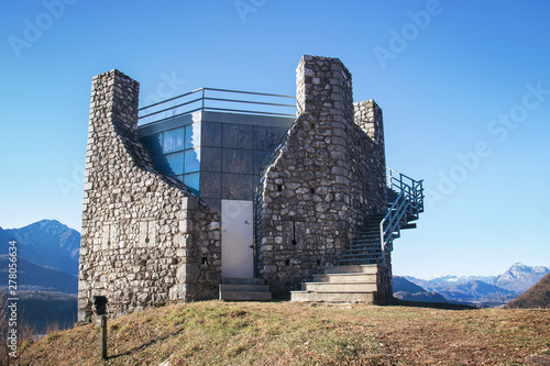 stone italian tower in the mountain. The building was erected in 1477 by the local government to counter the invasions of the Turks. It is located in Tolmezzo (Italy)