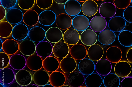 Abstract composition of colorful plastic straws seen from above, concept accessories to celebrate your party