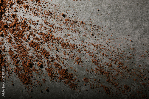 Cocoa powder on gray stone texture 