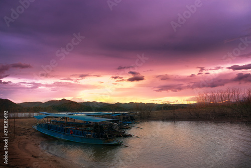 Boat on the bank of the lake at sunset, Kang Krajarn National Park, Petchaburi, Thailand