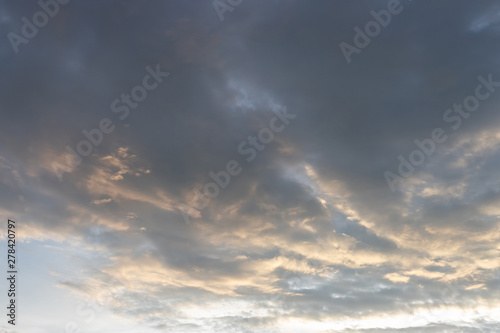 grey cloudy sky with strong wind in evening. strange cloud shape background and texture.