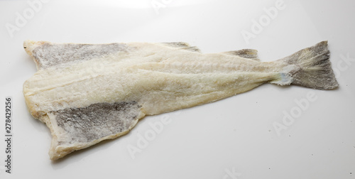 bacalao salado, pieza entera sobre fondo blanco. salted cod, whole piece on white background.