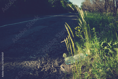 Plastic bottle with water by the road.