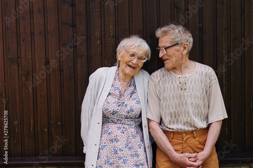 Portrait of two laughing senior friends. Great grandparents together.