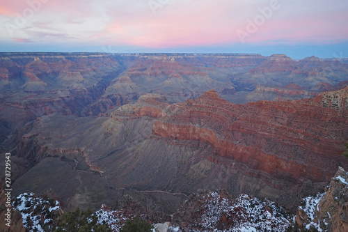 Pink clouds over the south rim of the Grand Canyon at sunset from Mather Point in Grand Canyon National Park, Arizona.