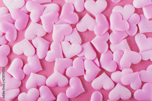 Many volumetric hearts on a pink background for Valentine's Day with love