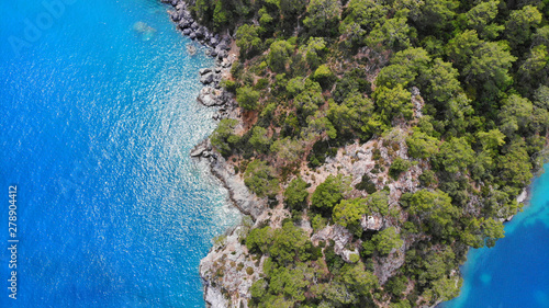 Aerial. Island in a blue sea. Top view.