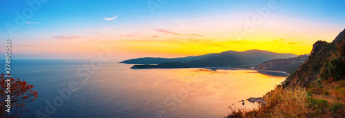 Panoramic view from above to the Adriatic sea coastline with Jaz beach at sunset time, Montenegro