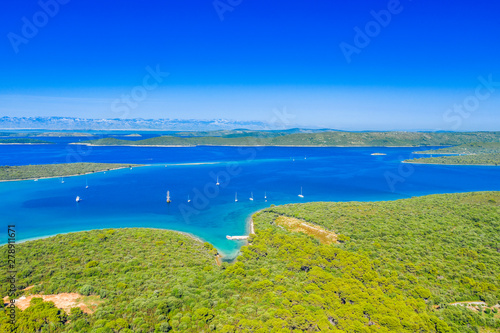 Beautiful seascape on Adriatic in Croatia, Dugi otok archipelago, yachts anchored in blue bays