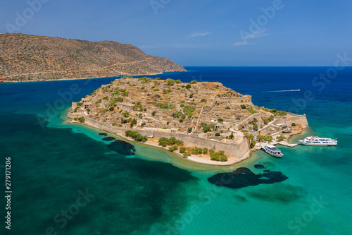 Aerial view of tourist boats on the ruins of the fortress and former leper colony island of Spingalonga (Elounda, Crete, Greece)