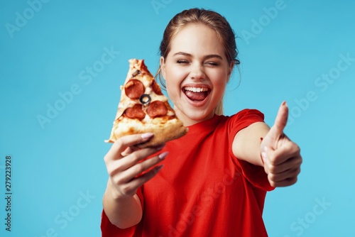 young man eating pizza