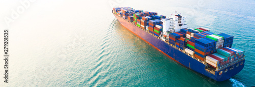 Aerial view container ship carrying container in import export business logistic and transportation of international by container cargo freight ship boat in the open sea, with copy space.