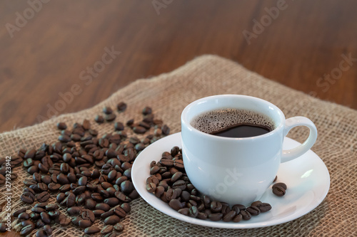 Hot coffee cup with roasted coffee beans