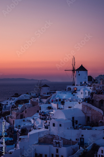 The white village of Oia, on the island of Santorini, Greece during a romantic red sunset.