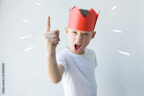 child dictator red paper crown establishes rules