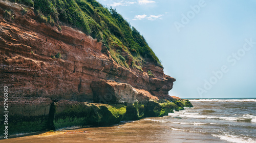 sandy beach with red sand and rock in Exmouth ,Devon, UK. Jurassic coast, british heritage site