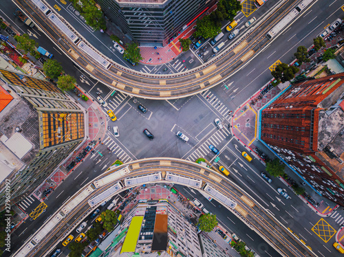 Aerial view of cars and trains with intersection or junction with traffic, Taipei Downtown, Taiwan. Financial district and business area. Smart urban city technology.