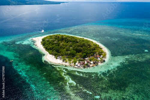 Aerial view of a beautiful tropical island surrounded by coral reef (Mantigue Island, Camiguin, Philippines)