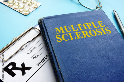 Multiple sclerosis MS book and prescription and pen.