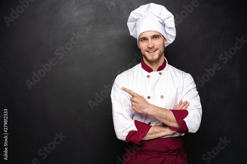 Chef presents something on a black background.
