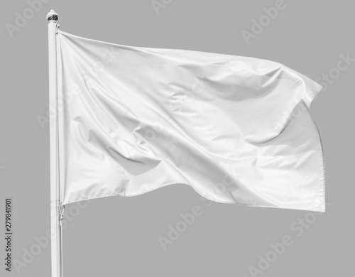 White flag waving in the wind on flagpole, isolated on gray background, closeup