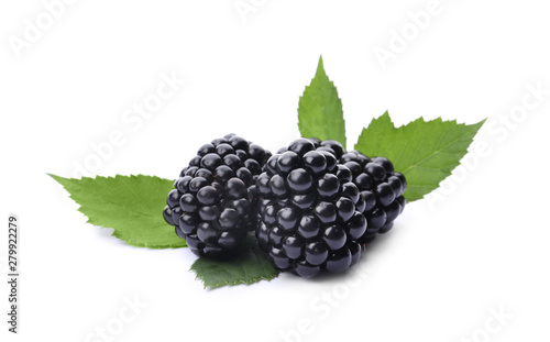 Tasty ripe blackberries with green leaves on white background