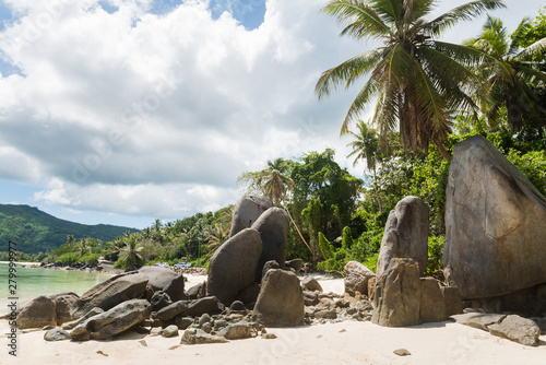 Big rocks on sandy Seychelles beach landscape