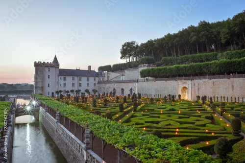 VILLANDRY CASTLE, FRANCE - JULY 07, 2017: The garden illuminated by 2,000 candles at dusk . Nights of a Thousand Lights at Villandry castle, France on July 07, 2017