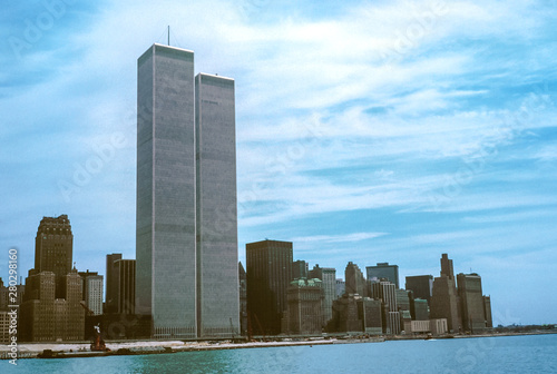 Iconic World Trade Center featured as landmark of the Twin Towers from New Jersey and Hudson River. Archival vintage cityscape of New York city skyline. Manhattan in NYC, United States.