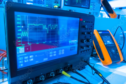 Instrumentation in the laboratory. Oscilloscope. Radioelectronics. Research of parameters of an electric signal. Graphics on the device screen. Scientific research.