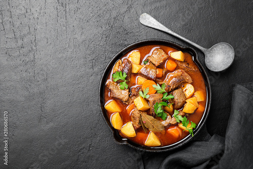 Beef meat stewed with potatoes, carrots and spices (hungarian goulash).