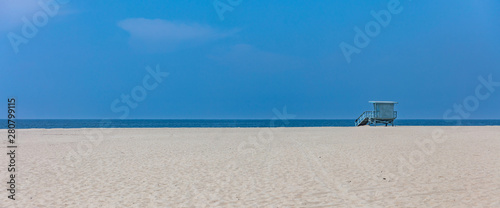 Lifeguard hut on Santa Monica beach. Pacific ocean coastline Los Angeles USA.