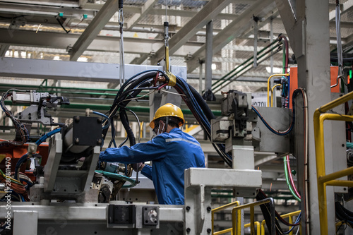 Workers in machinery factory in China.