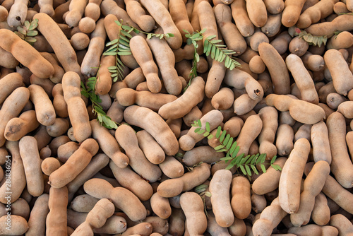 Stacked of dried tamarind fruits, Sweet tamarind for healthy