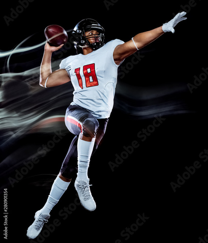 one african american football player man studio shot isolated on black background with light painting with blurred motion speed effect