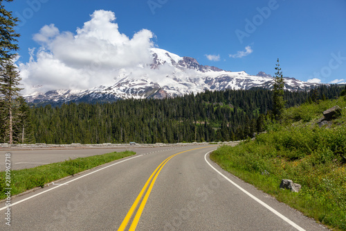 Beautiful view of a scenic road surrounded by the Mountain Landscape during a sunny summer day. Taken in Paradise, Mt Rainier National Park, Washington, United States of America.