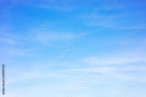 Blue sky background and white clouds soft focus, and copy space