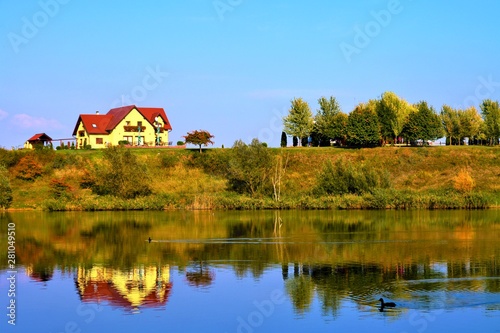 a house on the shore of a lake