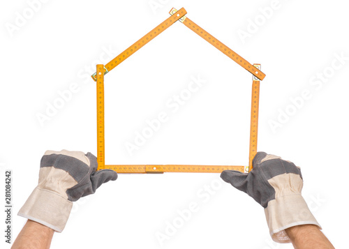 Male Hand wearing Working Glove with yellow wooden meter. Human Hand holding tool forming a house, Isolated on White Background.