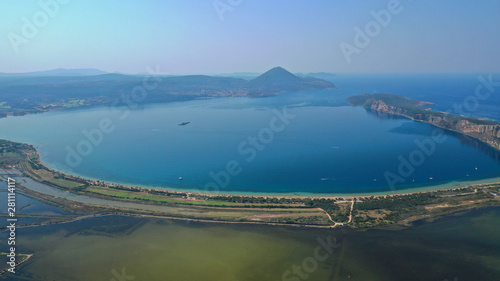 Aerial drone photo of iconic round shaped exotic sandy beach of Voidokoilia in the heart of Messinia, Gialova, Peloponnese, Greece