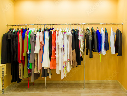 hanger with modern clothes on a yellow background, a screen saver for the store, fabric