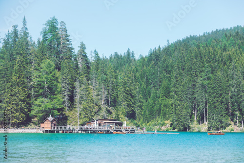 view of dock with boats in lago di braies in alps mountains