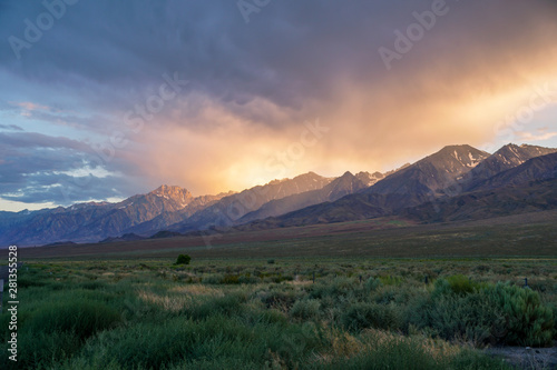 Mountain range colorful sunset with clouds before storm , Eastern Sierra Mountains, Mono County, California, USA