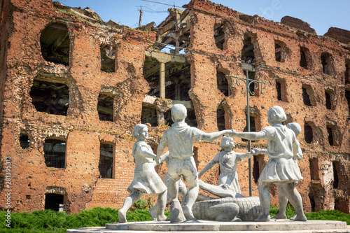 Volgograd/Russia-18.06.2016:The statue of with circle of kids and crocodile and destroyed building
