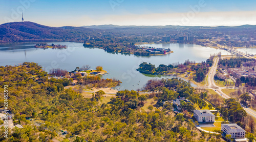 Panorama view of Canberra, the capital city of Australia, looking north over Lake Burley Griffin with Black Mountain and Telstra Tower to the left and Commonwealth Bridge at right