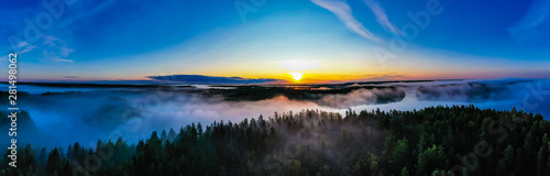 Sun rises in morning, panorama landscape. Aerial scenery in countryside. Forest and fog concept